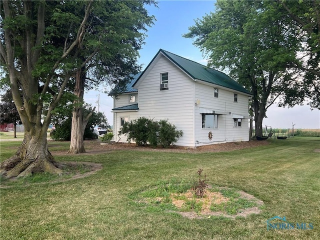 8872 Rd 87, Paulding, OH 45879 - view of side of property featuring a lawn and a metal roof