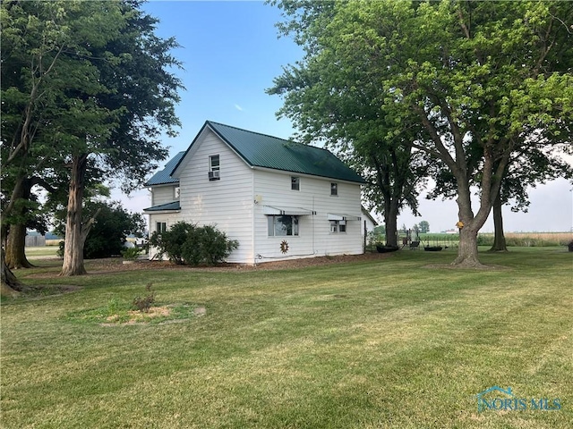 8872 Rd 87, Paulding, OH 45879 - view of property exterior featuring a yard and a metal roof