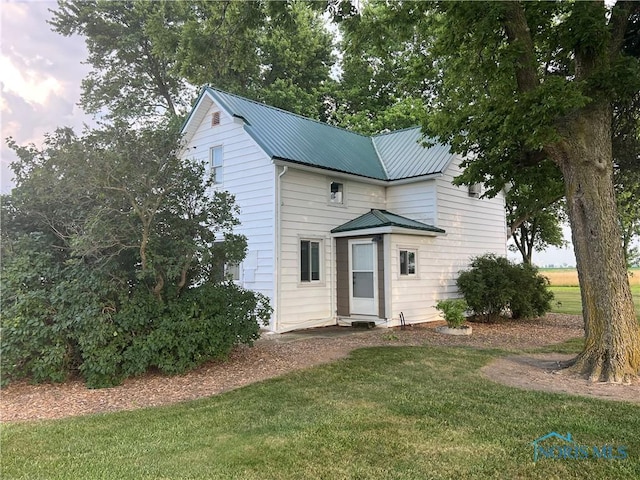 8872 Rd 87, Paulding, OH 45879 - traditional-style home featuring a front lawn and a metal roof