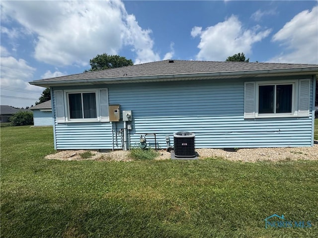 1926 Tiffin Rd, Fremont, OH 43420 - view of property exterior featuring a yard and roof with shingles