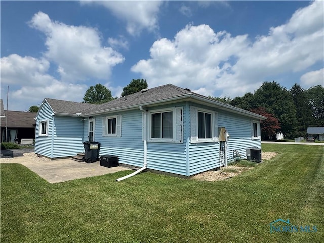 1926 Tiffin Rd, Fremont, OH 43420 - rear view of house featuring a yard, a patio area, and roof with shingles