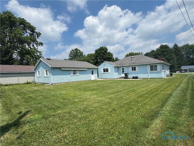 1926 Tiffin Rd, Fremont, OH 43420 - rear view of house with a lawn