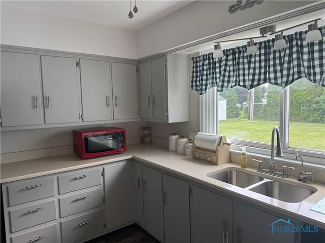 1926 Tiffin Rd, Fremont, OH 43420 - kitchen featuring light countertops and gray cabinetry
