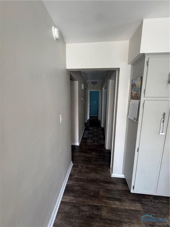 1926 Tiffin Rd, Fremont, OH 43420 - hallway featuring dark wood-type flooring and baseboards