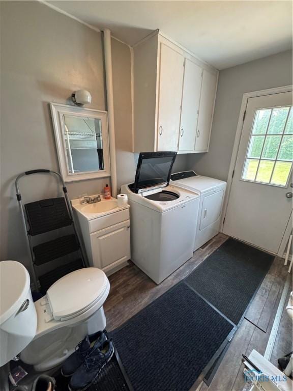 1926 Tiffin Rd, Fremont, OH 43420 - laundry area with washer and dryer and wood finished floors