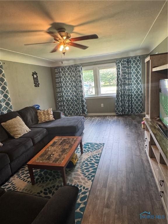 1926 Tiffin Rd, Fremont, OH 43420 - living room with a ceiling fan and dark wood-style flooring