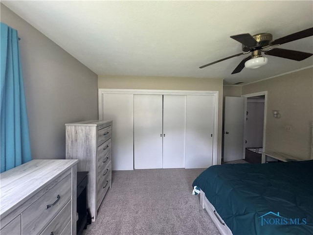 1926 Tiffin Rd, Fremont, OH 43420 - bedroom featuring a closet, light colored carpet, and a ceiling fan