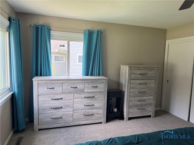 1926 Tiffin Rd, Fremont, OH 43420 - carpeted bedroom featuring multiple windows