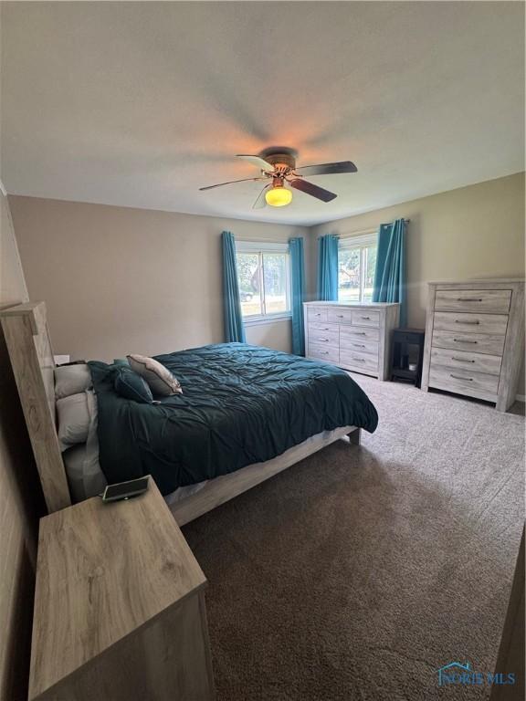 1926 Tiffin Rd, Fremont, OH 43420 - carpeted bedroom featuring ceiling fan