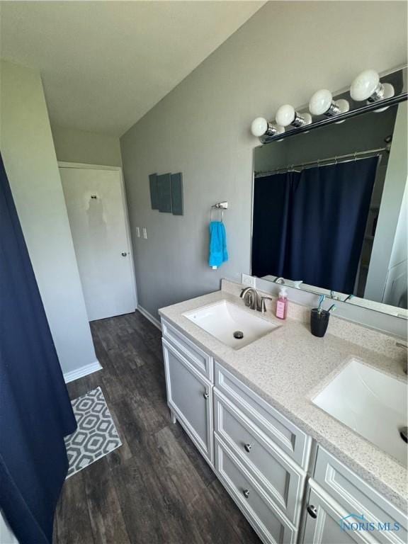 1926 Tiffin Rd, Fremont, OH 43420 - bathroom with double vanity and wood finished floors