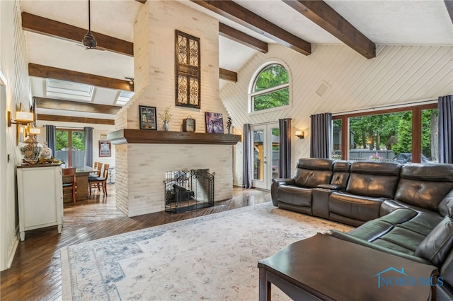 618 Sutton Pl, Findlay, OH 45840 - living room featuring healthy amount of natural light, hardwood / wood-style flooring, beamed ceiling, wooden walls, and a fireplace