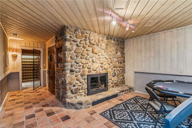 618 Sutton Pl, Findlay, OH 45840 - unfurnished office featuring wooden ceiling, tile patterned flooring, wood walls, and a stone fireplace