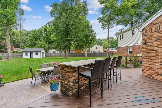 618 Sutton Pl, Findlay, OH 45840 - wooden deck with a fenced backyard and an outdoor structure