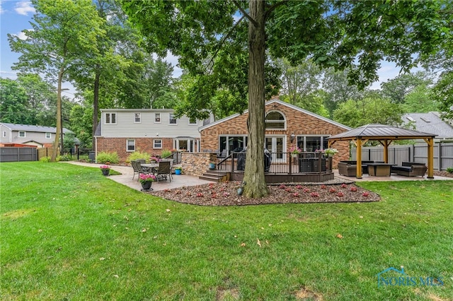 618 Sutton Pl, Findlay, OH 45840 - rear view of property with an outdoor hangout area, a gazebo, a patio area, and a fenced backyard