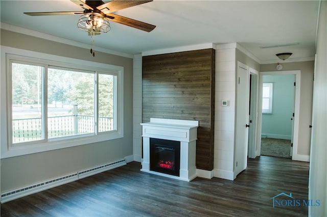1474 S Clinton St, Defiance, OH 43512 - unfurnished living room with a baseboard heating unit, crown molding, a ceiling fan, dark wood-style floors, and a glass covered fireplace