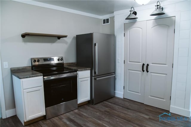 1474 S Clinton St, Defiance, OH 43512 - kitchen with stainless steel appliances, open shelves, dark countertops, white cabinetry, and dark wood finished floors