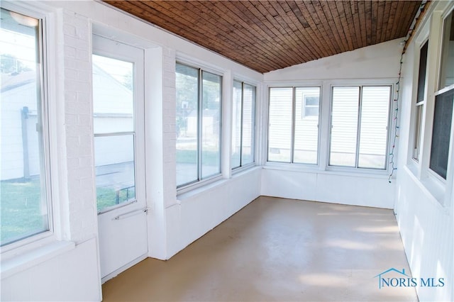 1474 S Clinton St, Defiance, OH 43512 - unfurnished sunroom with vaulted ceiling, finished concrete floors, wooden ceiling, and plenty of natural light
