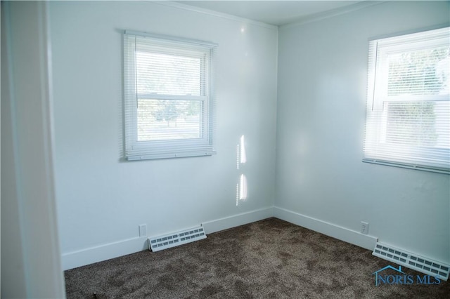 1474 S Clinton St, Defiance, OH 43512 - unfurnished room featuring dark carpet and baseboards