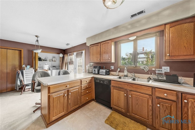304 Fulton St, Fayette, OH 43521 - kitchen with black dishwasher, a peninsula, healthy amount of natural light, and light countertops