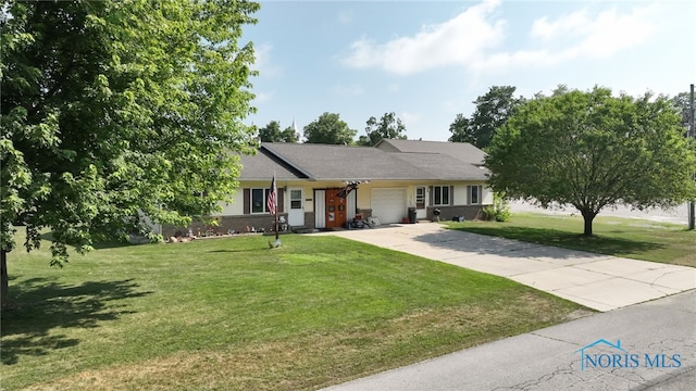 304 Fulton St, Fayette, OH 43521 - ranch-style home featuring a garage, a front lawn, and concrete driveway