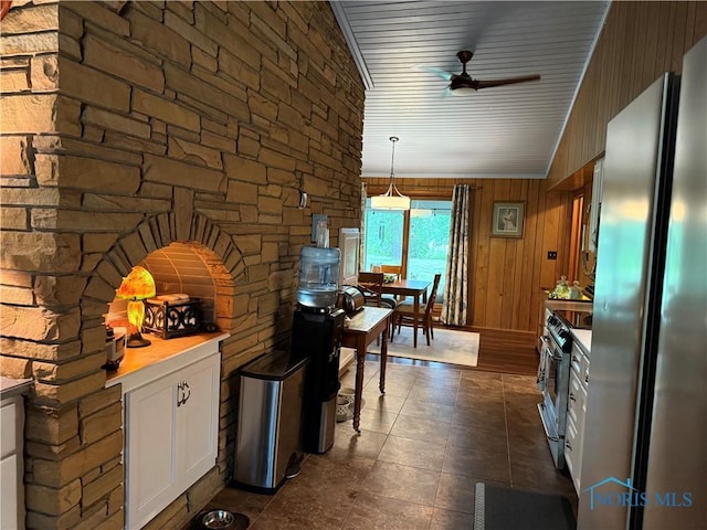 19445 Powers Rd, Defiance, OH 43512 - kitchen featuring stainless steel appliances, ceiling fan, white cabinetry, hanging light fixtures, and light countertops