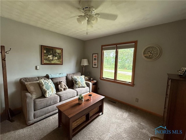 19445 Powers Rd, Defiance, OH 43512 - carpeted living room with ceiling fan and baseboards