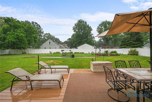 3605 W Laskey Rd, Toledo, OH 43623 - fenced backyard featuring outdoor dining space and a patio area