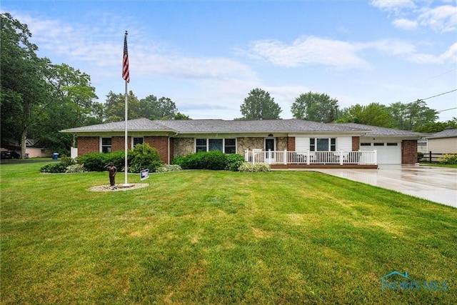 3605 W Laskey Rd, Toledo, OH 43623 - ranch-style home with an attached garage, concrete driveway, a front yard, brick siding, and stone siding