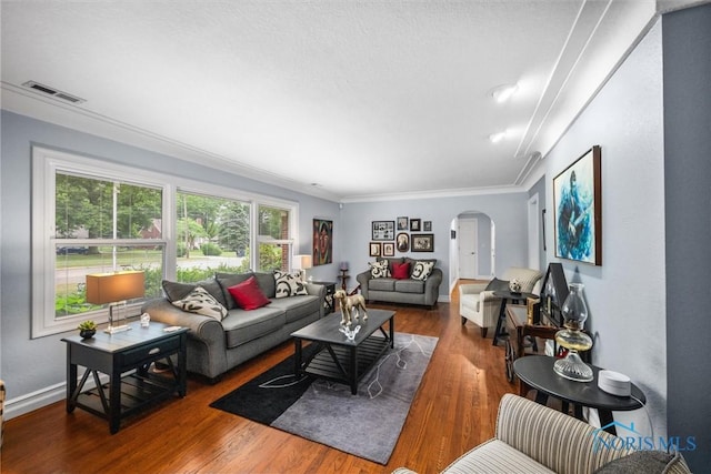 3605 W Laskey Rd, Toledo, OH 43623 - living area featuring arched walkways, crown molding, and wood finished floors