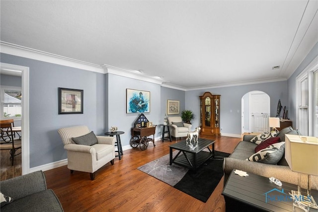 3605 W Laskey Rd, Toledo, OH 43623 - living room featuring arched walkways, ornamental molding, and wood finished floors