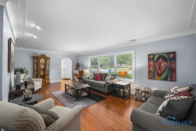 3605 W Laskey Rd, Toledo, OH 43623 - living room featuring arched walkways, ornamental molding, and wood finished floors