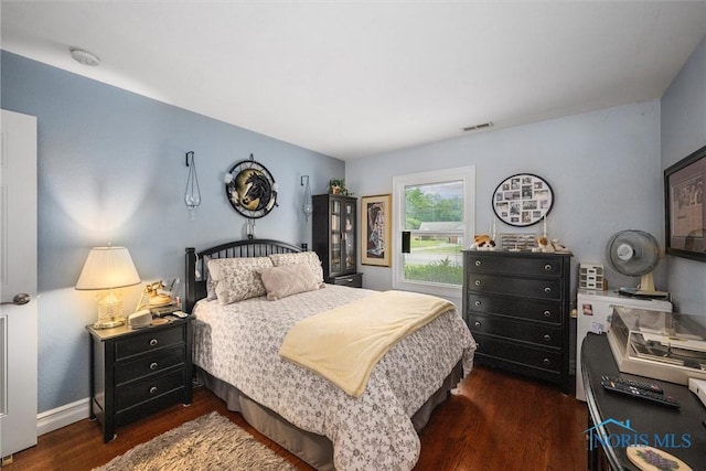 3605 W Laskey Rd, Toledo, OH 43623 - bedroom with dark wood-type flooring and baseboards