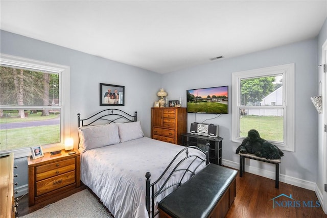 3605 W Laskey Rd, Toledo, OH 43623 - bedroom featuring wood finished floors and baseboards