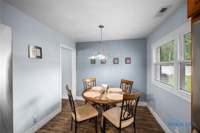 3605 W Laskey Rd, Toledo, OH 43623 - dining room featuring dark wood-style floors and baseboards