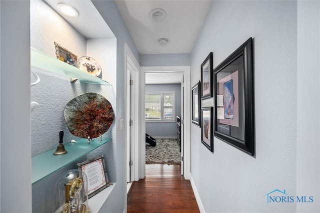3605 W Laskey Rd, Toledo, OH 43623 - corridor featuring dark wood-type flooring and baseboards