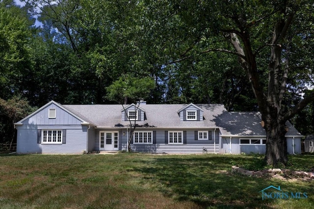 4906 Pine Ridge Rd, Toledo, OH 43615 - cape cod home featuring a front lawn
