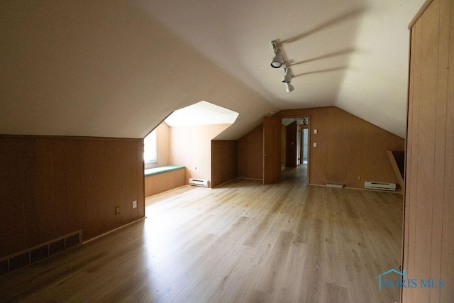 4906 Pine Ridge Rd, Toledo, OH 43615 - bonus room with baseboard heating, wood finished floors, and vaulted ceiling