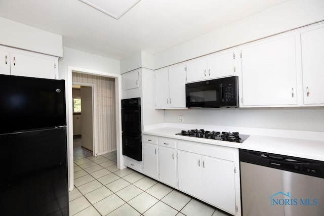 4906 Pine Ridge Rd, Toledo, OH 43615 - kitchen featuring black appliances, light countertops, white cabinetry, and light tile patterned floors
