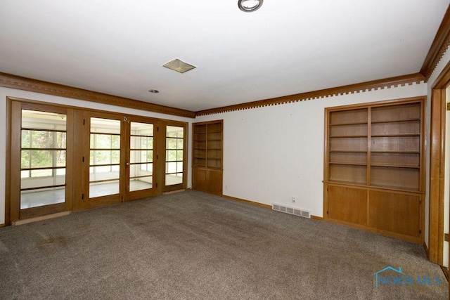 4906 Pine Ridge Rd, Toledo, OH 43615 - carpeted spare room with french doors and built in features