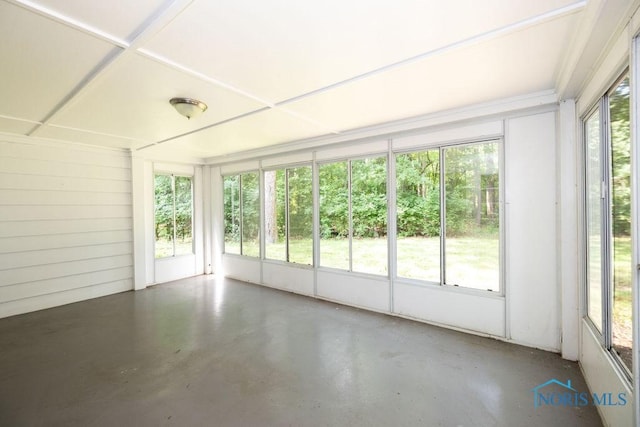 4906 Pine Ridge Rd, Toledo, OH 43615 - unfurnished sunroom featuring plenty of natural light and concrete flooring