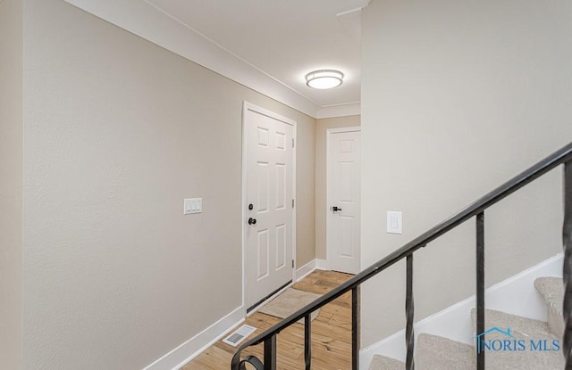 4308 Willis Blvd, Toledo, OH 43623 - foyer with light wood finished floors and stairs