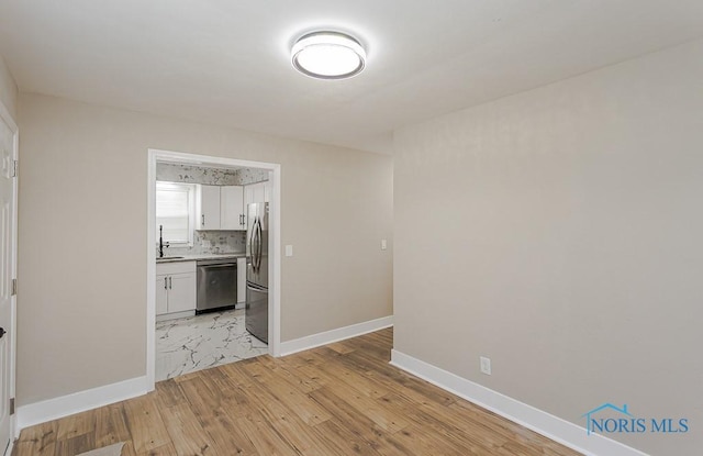 4308 Willis Blvd, Toledo, OH 43623 - unfurnished room with light wood-style flooring and a sink