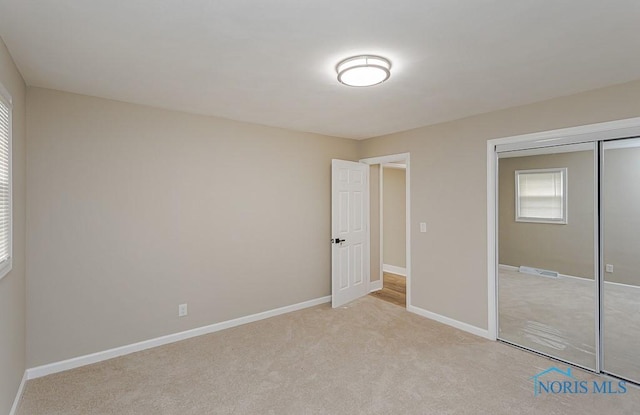 4308 Willis Blvd, Toledo, OH 43623 - unfurnished bedroom featuring a closet and light carpet