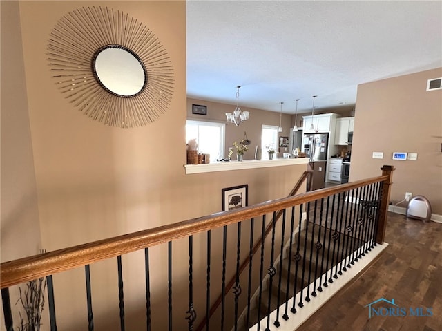 410 Spring St, Upper Sandusky, OH 43351 - staircase featuring wood finished floors and a chandelier