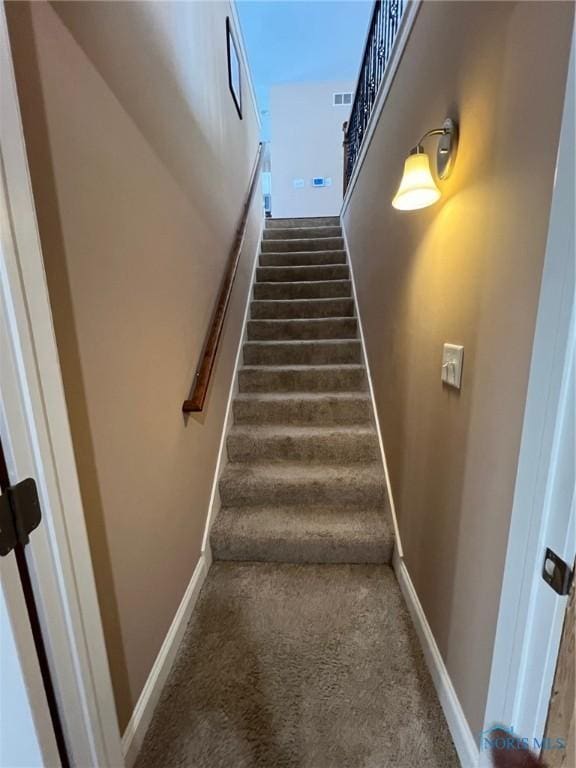 410 Spring St, Upper Sandusky, OH 43351 - stairs featuring carpet