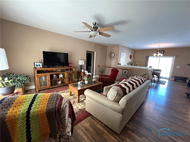 410 Spring St, Upper Sandusky, OH 43351 - living area with dark wood-style flooring, ceiling fan, and a chandelier