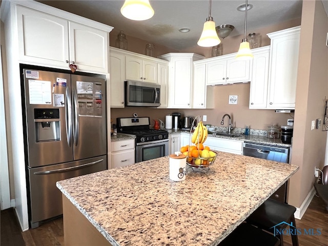 410 Spring St, Upper Sandusky, OH 43351 - kitchen featuring appliances with stainless steel finishes, dark wood-type flooring, white cabinets, and recessed lighting