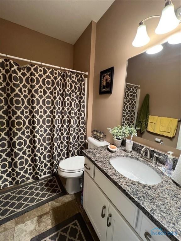 410 Spring St, Upper Sandusky, OH 43351 - full bathroom with vanity, stone finish flooring, and curtained shower