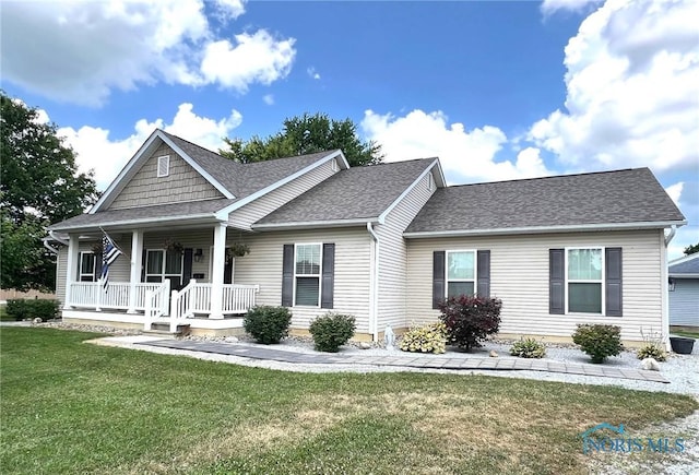 410 Spring St, Upper Sandusky, OH 43351 - view of front of house featuring a porch, a front lawn, and roof with shingles
