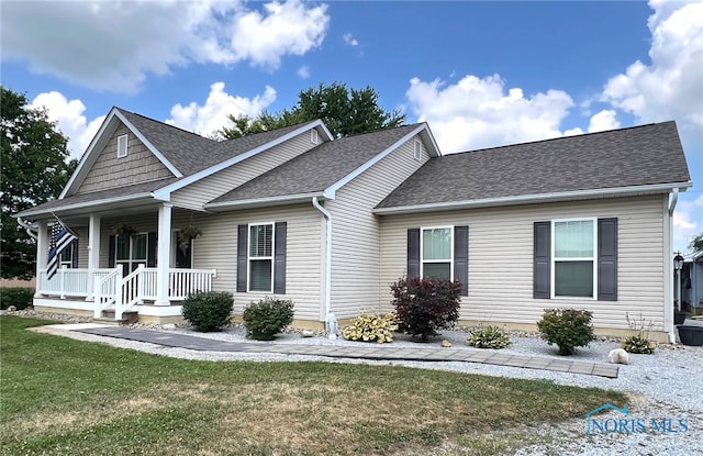 410 Spring St, Upper Sandusky, OH 43351 - view of front of property featuring a shingled roof, covered porch, and a front lawn